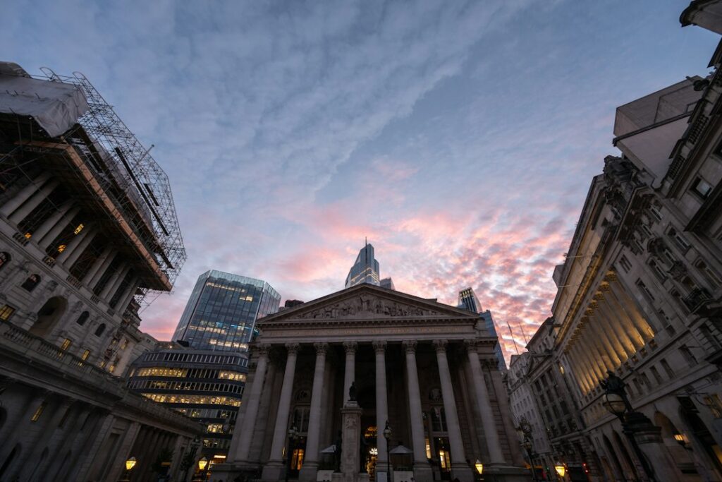 The Royal Exchange building in London's financial district at dusk, representing the City of London's role as a global financial hub and the new gateway for UK retail investors to access crypto through regulated products on the London Stock Exchange.