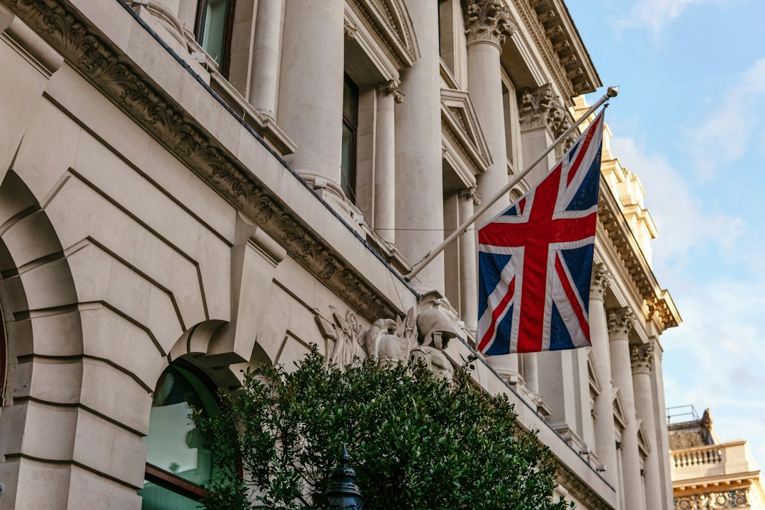 FCA Crypto Authorisation: Oct 2027 Deadline 44 UK flag on a government building, symbolising regulatory authority and oversight