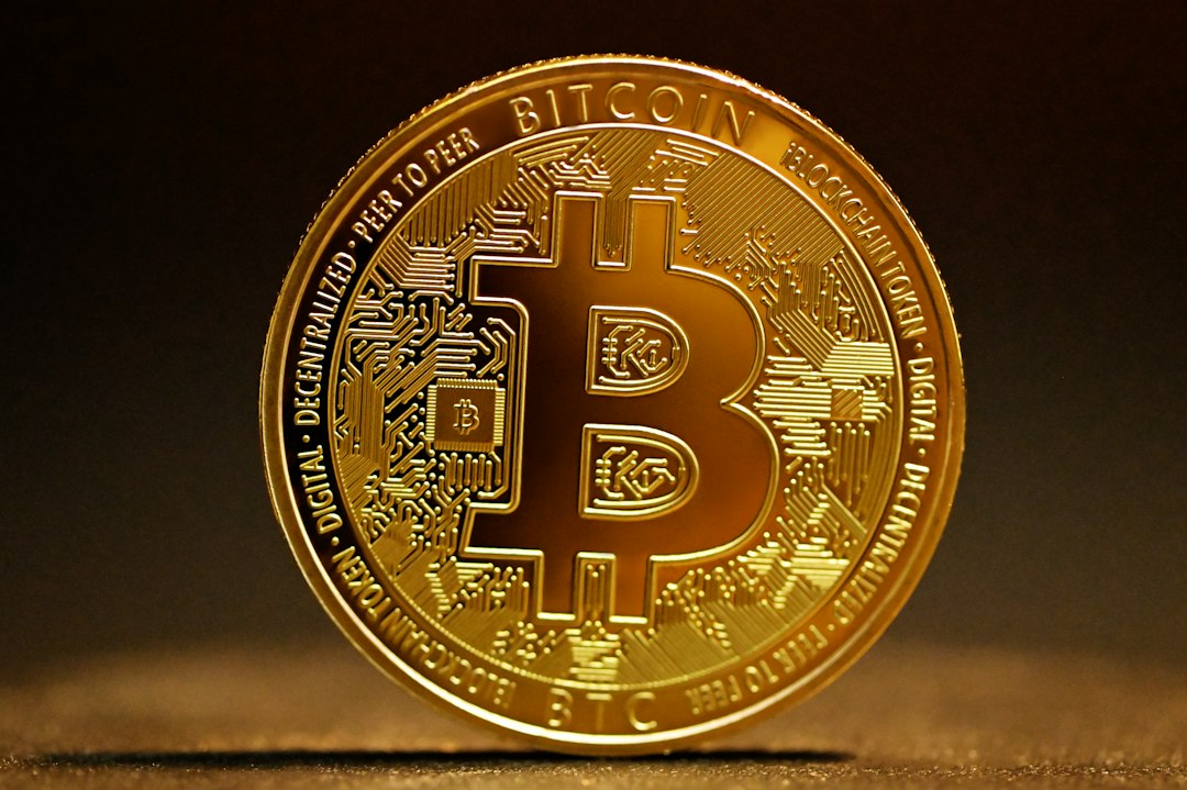 A shiny gold Bitcoin coin with the distinctive Bitcoin symbol, representing the seized cryptocurrency at the centre of the legal battle