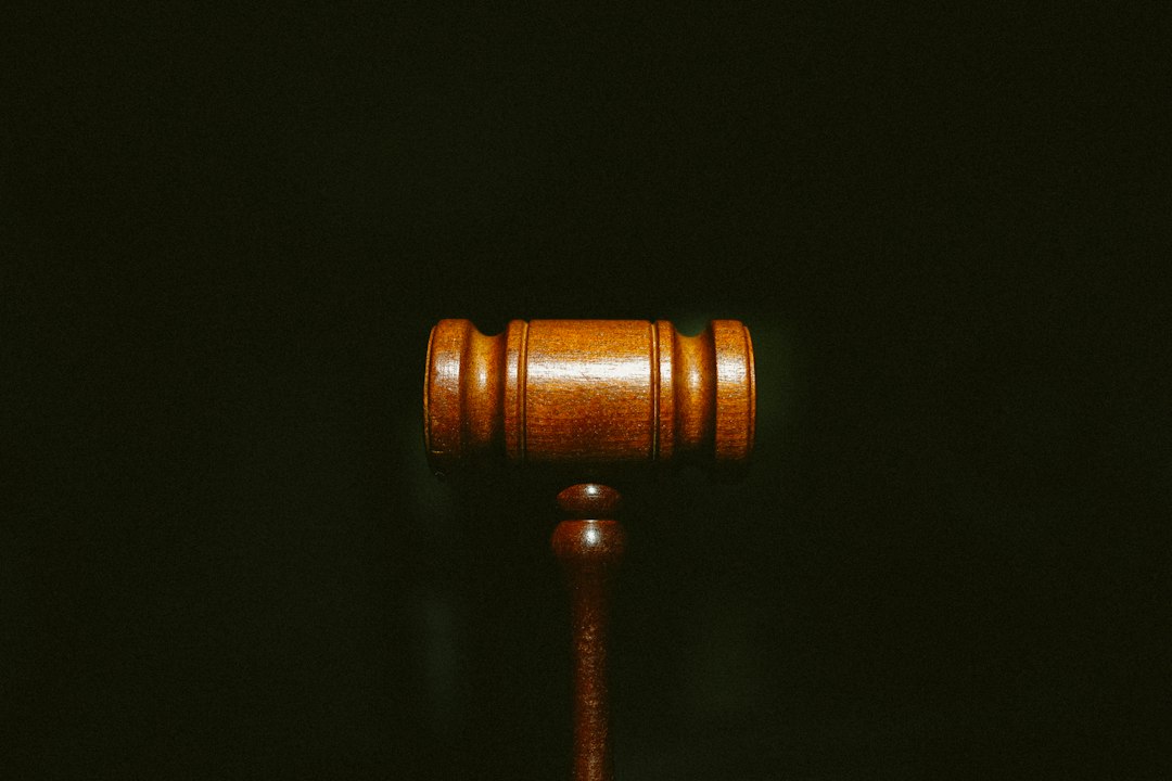 Wooden gavel on dark background representing UK court decision