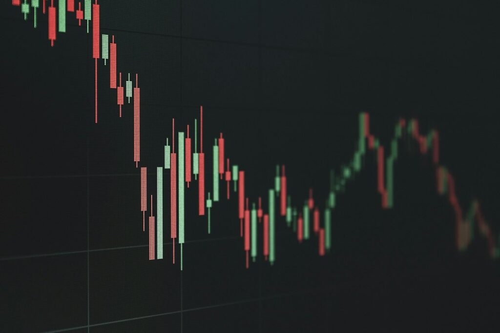 Stock market chart showing declining Bitcoin price trend with red candlestick patterns