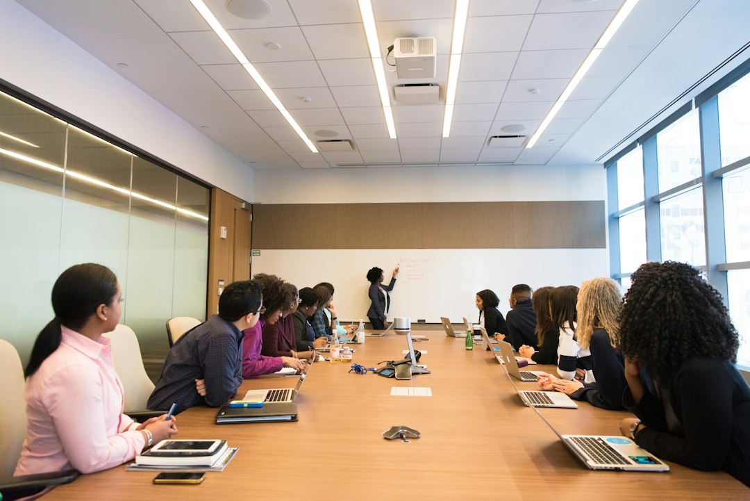 Corporate executives in a boardroom meeting discussing investment strategy