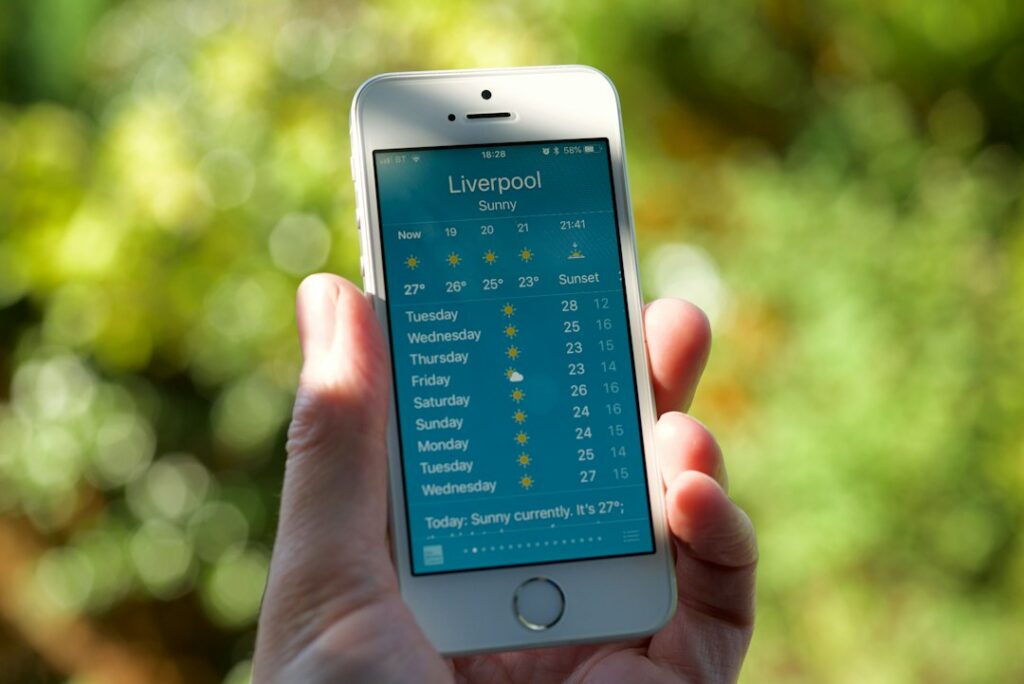 Person holding smartphone displaying investment app interface