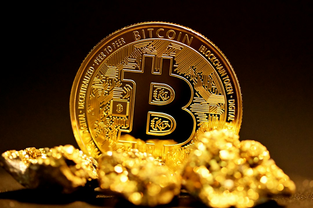 Close-up of a physical gold Bitcoin coin