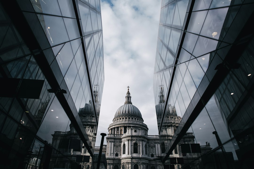 London skyscrapers and a historic building in the City of London representing UK regulatory and financial infrastructure