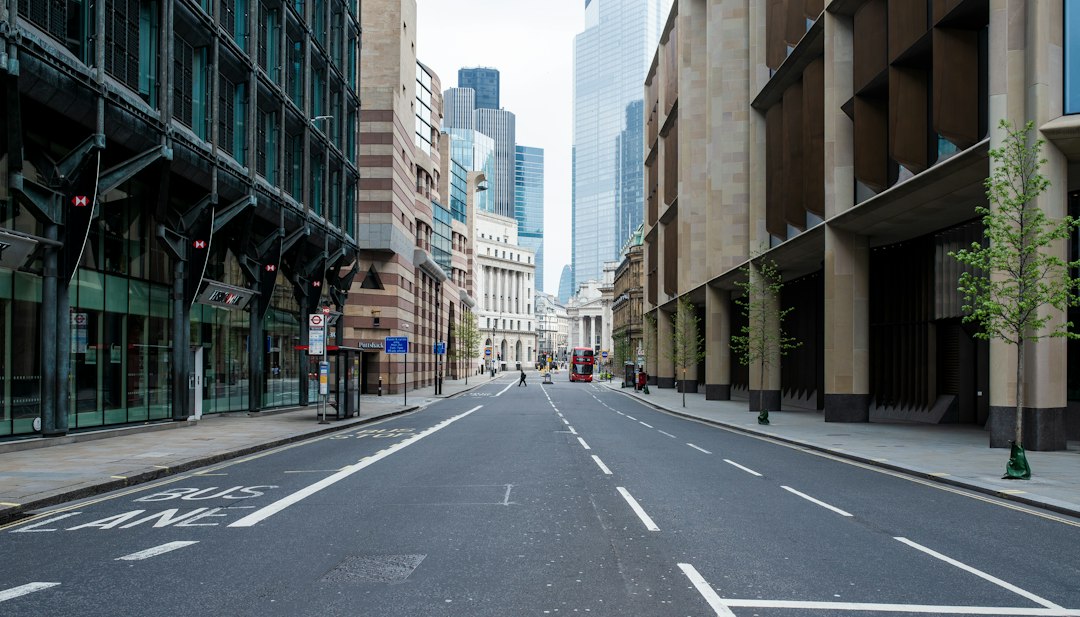 Grey concrete road between high-rise London buildings